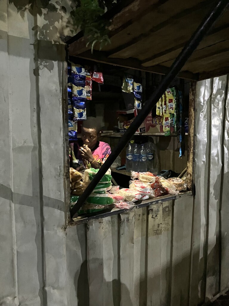 Abuja Night Market: Kiosk Glowing in the Dark by vincent24