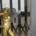 golden mannequin in cotonou street 