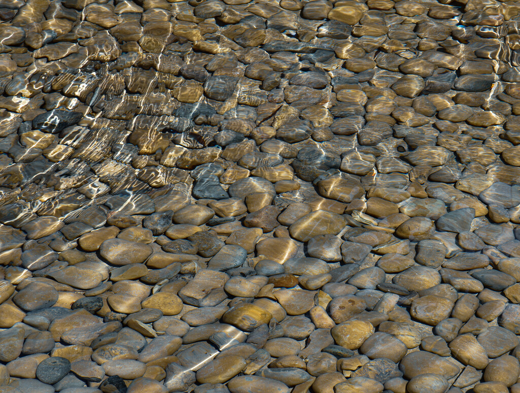 Pebbles and ripples by tiaj1402