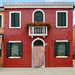 house with red curtain Burano by brigette
