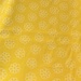 Bright yellow cloth with white Daises