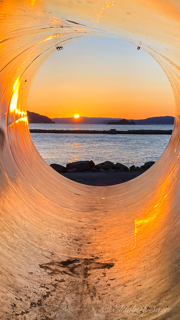Sunset through a tube by elisasaeter