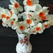 A vase of orange centred daffodils.  by grace55