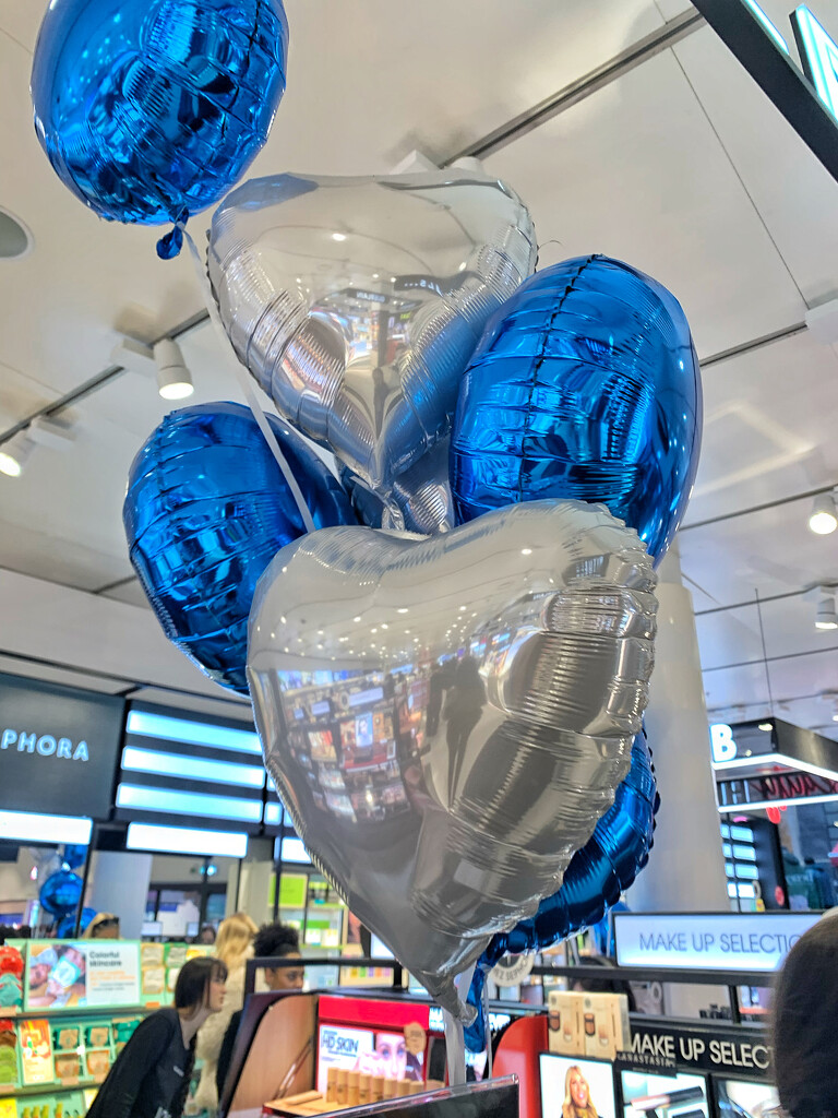 White and blue heart balloons.  by cocobella