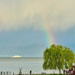 Boat and rainbow.  by cocobella