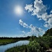 Marsh sky and summer-like clouds in April.  by congaree
