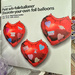 Three red heart balloon. 
