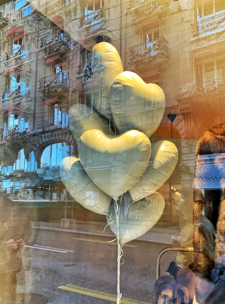A bunch of white balloon hearts.  by cocobella