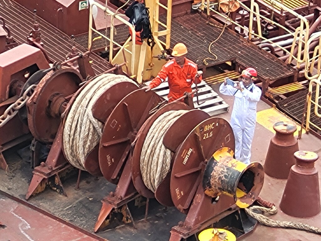 Workmen on cargo ship by paulabriggs
