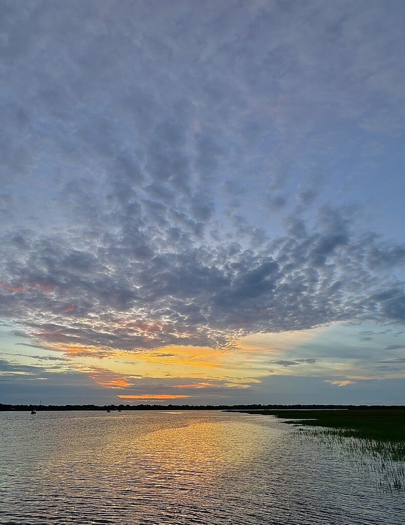 Sunset over the Ashley River near where it meets the Atlantic Ocean by congaree