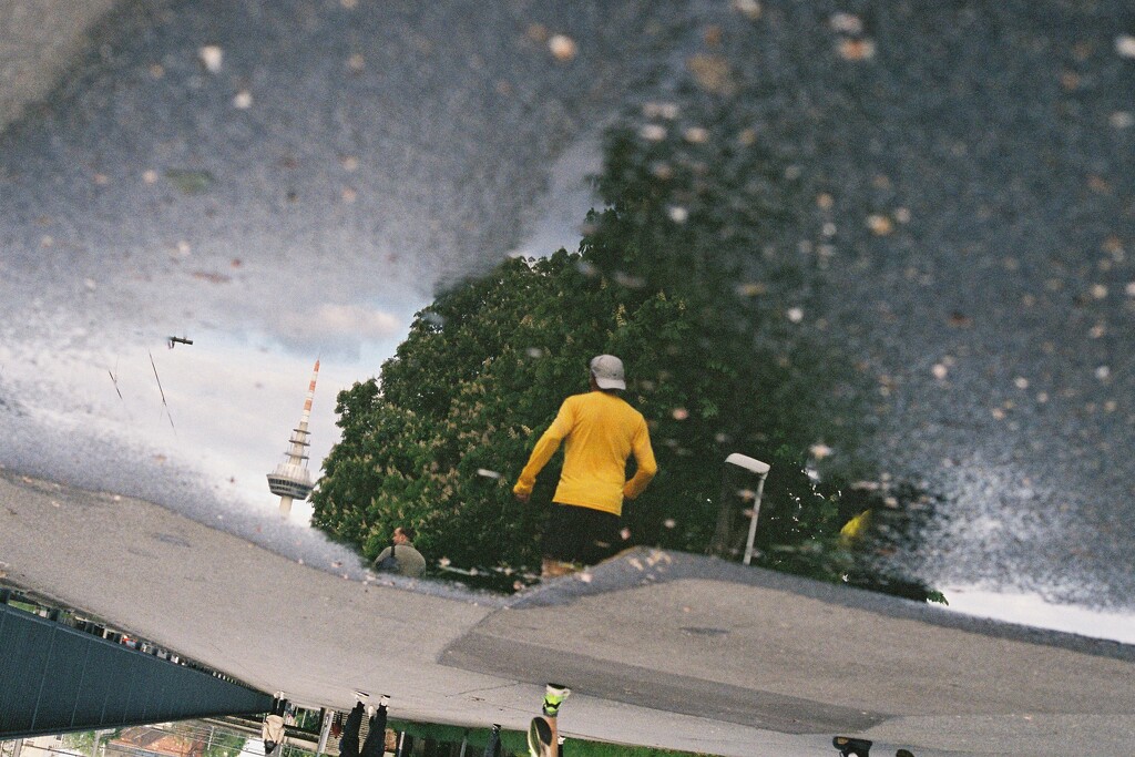 Analog - Runner in puddle by vincent24