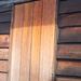 Wooden Shutters on Wooden House. 