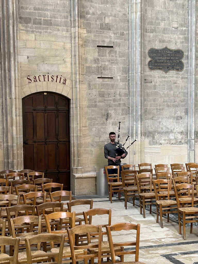 Bagpiper at Bayeux Cathedral by swagman
