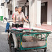 Lady on a tri-shaw cart 