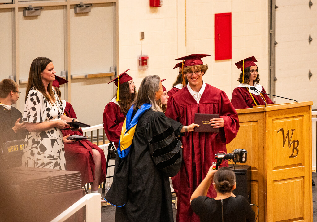 Caleb gets diploma by myhrhelper