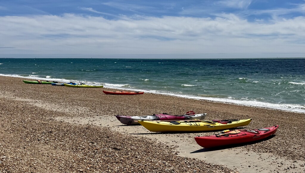 Kayaks on the beach by wakelys