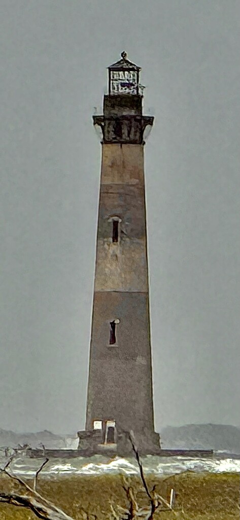 The iconic 1886  Morris Island Lighthouse, a half Mille away across the marsh from the dock where I took this photo.   by congaree