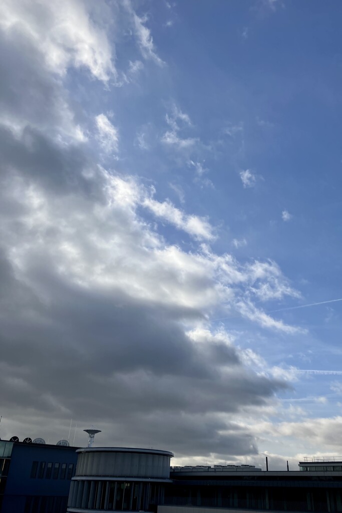 A diagonal of clouds over the office  by vincent24