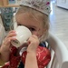 A two year old princess at tea