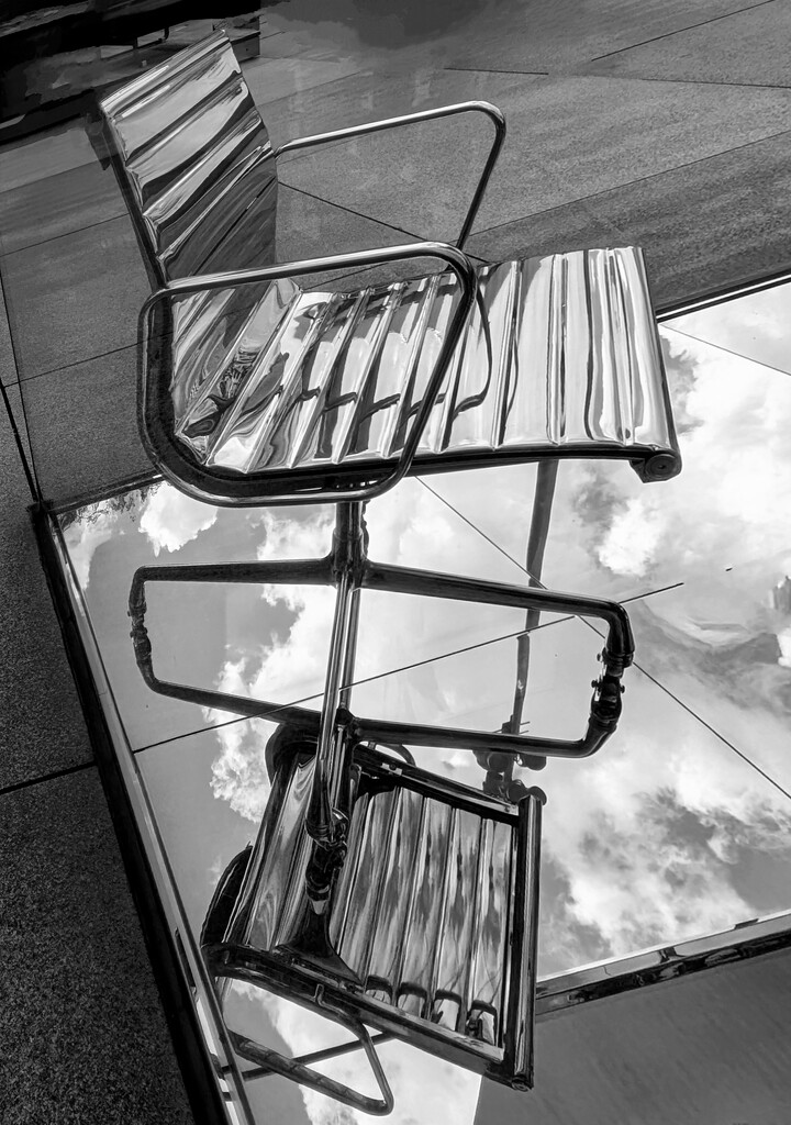 A chair and its reflection by zilli