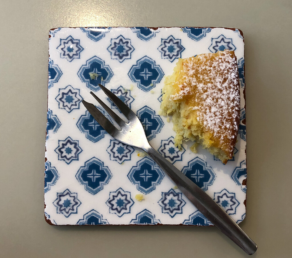 orange cake and fork on tile by brigette