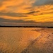 Sunset over the Ashley River and marshes at low tide. by congaree