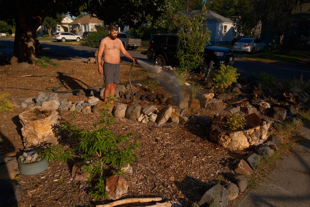 Boyfriend watering the garden by josharp186