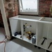 The cupboard unit and plumbing going in by samcat