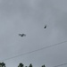 Bi-plane escorted by a helicopter  by happyteg