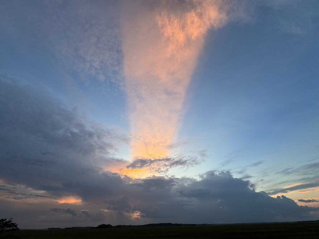 A most unusual and mystical sunset cloud formation over the marsh by congaree