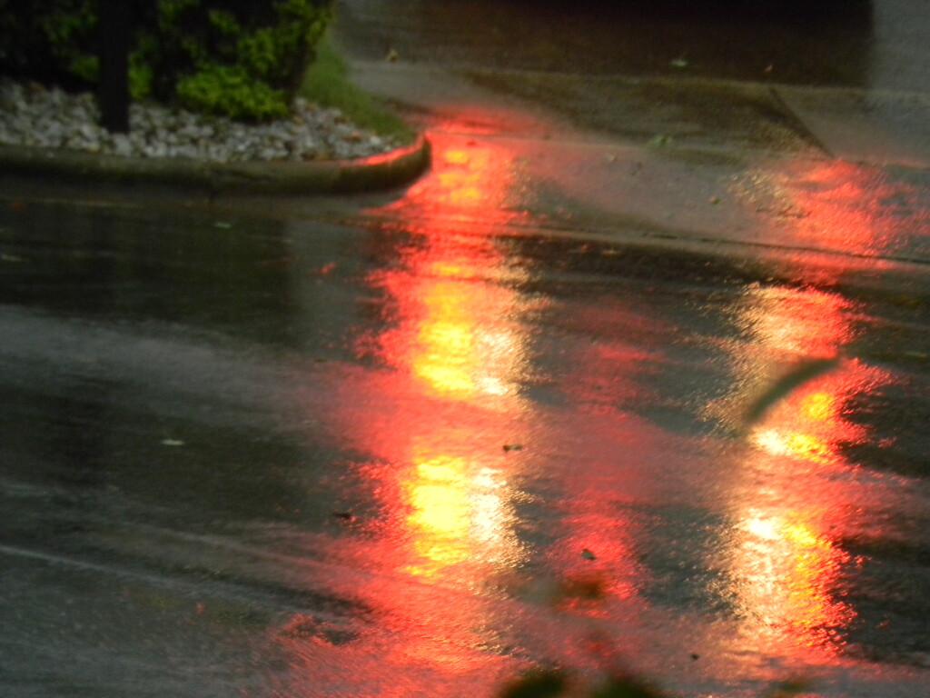 Red Light Reflection in Rain by sfeldphotos