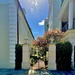 Entrance to a garden on a bright, sunlit day by congaree