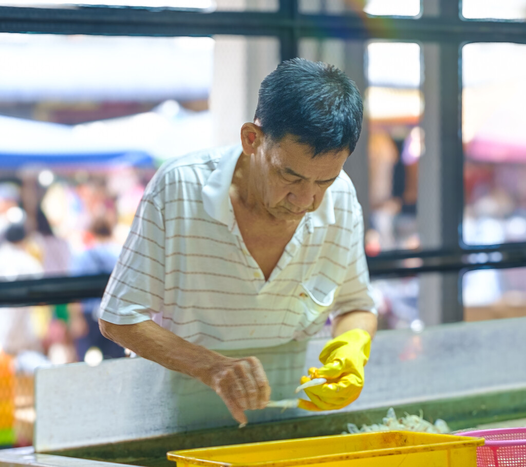 Shelling Prawns in the Wet Market. by ianjb21