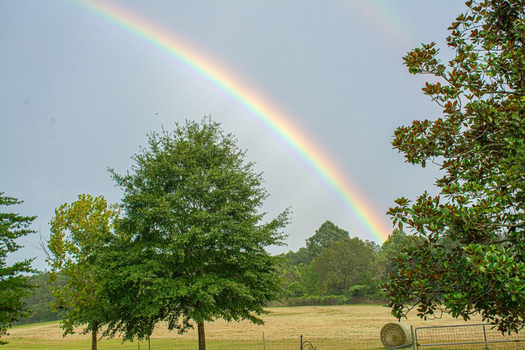 Rainbow over the hayfield... by thewatersphotos