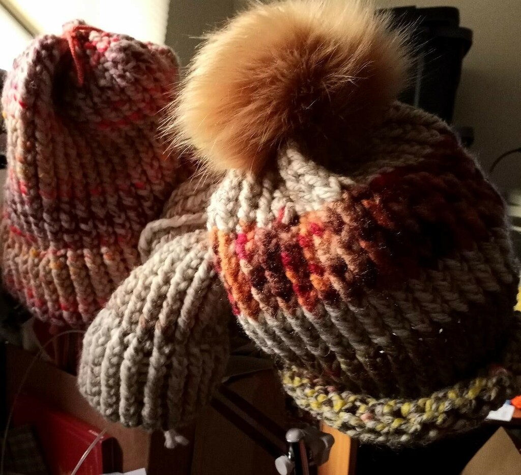 Working on completion of knit hats by sewfree