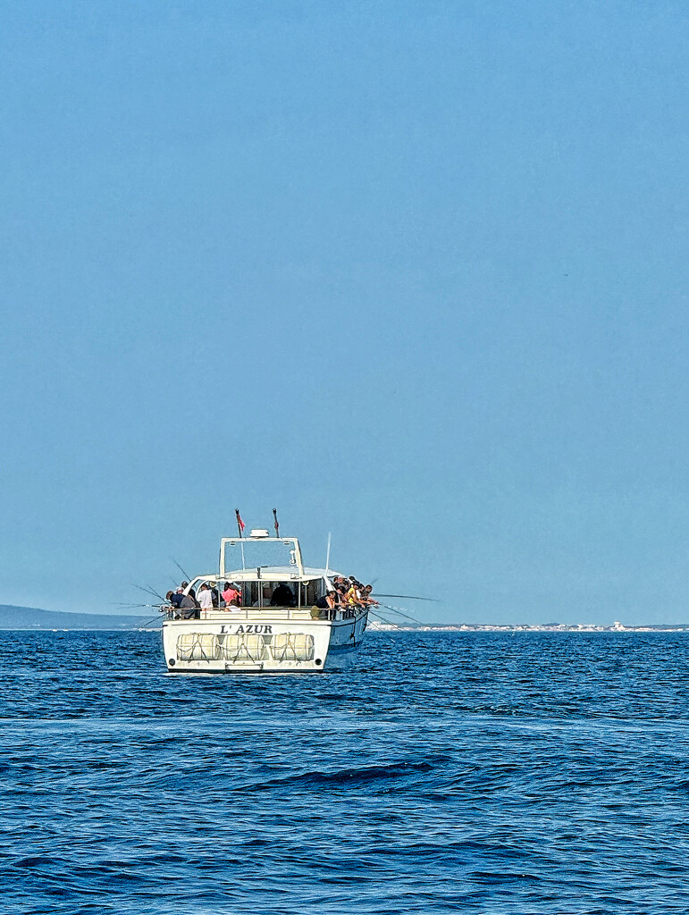 A boat full of fishermen.  by cocobella