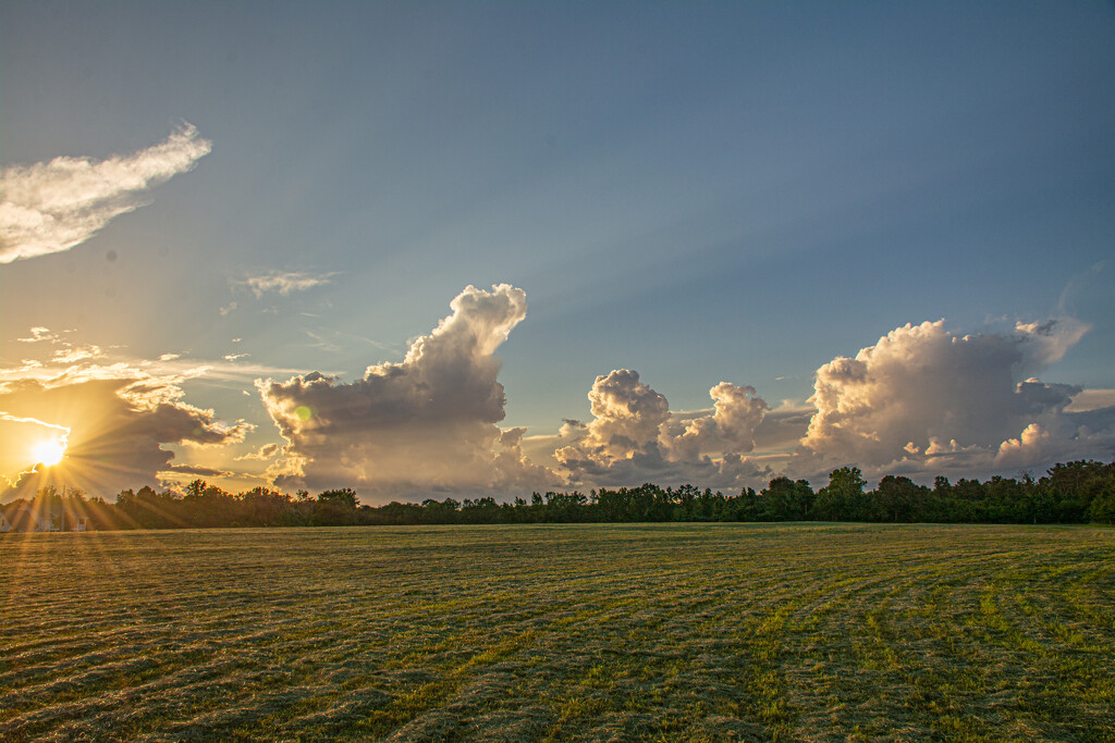 Sunset over the hayfield... by thewatersphotos