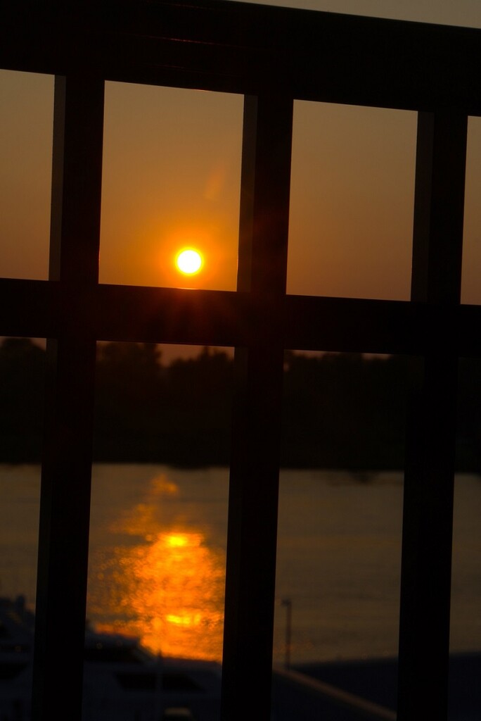 Sunset Thru the Railing by thedarkroom