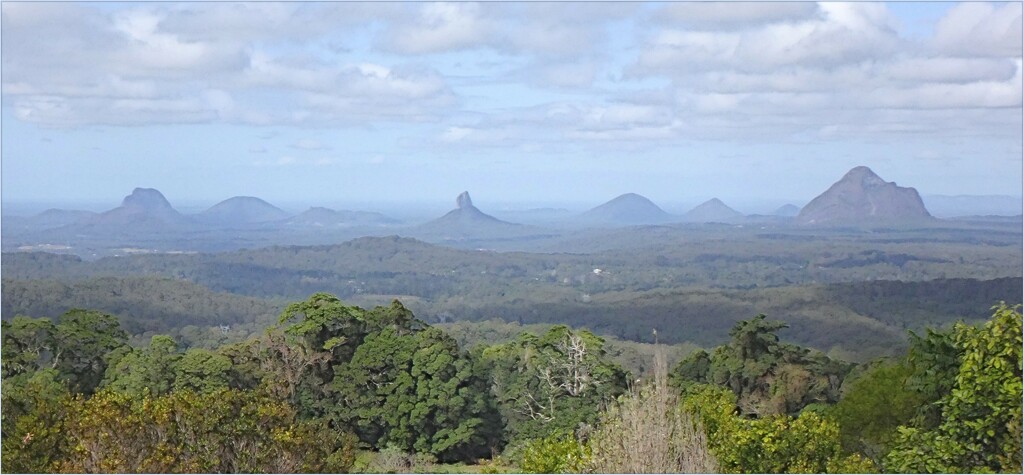 The Glasshouse Mountains - from a distance, on a foggy day. by robz