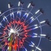 Ferris wheel against the dusk sky by sjgiesman