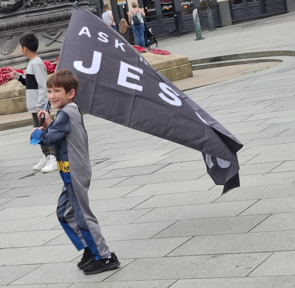 Day 249/366. A young child with a flag saying Ask me about Jesus.   by fairynormal