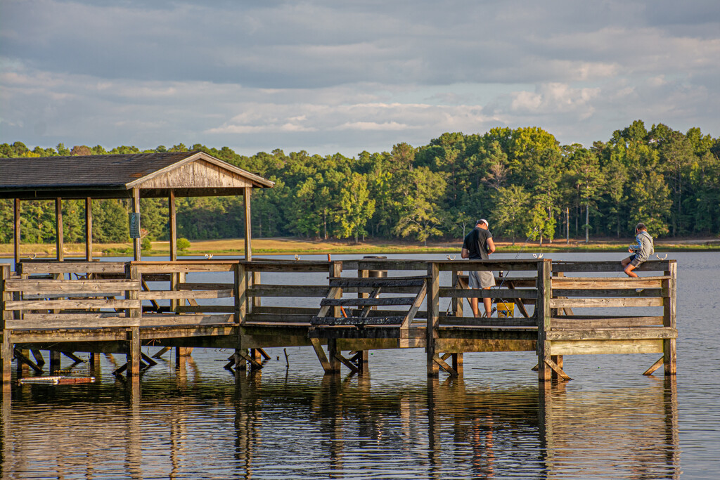 Dad and son fishing... by thewatersphotos