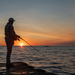 Fishing off the pier in Grand Haven, MI by dridsdale