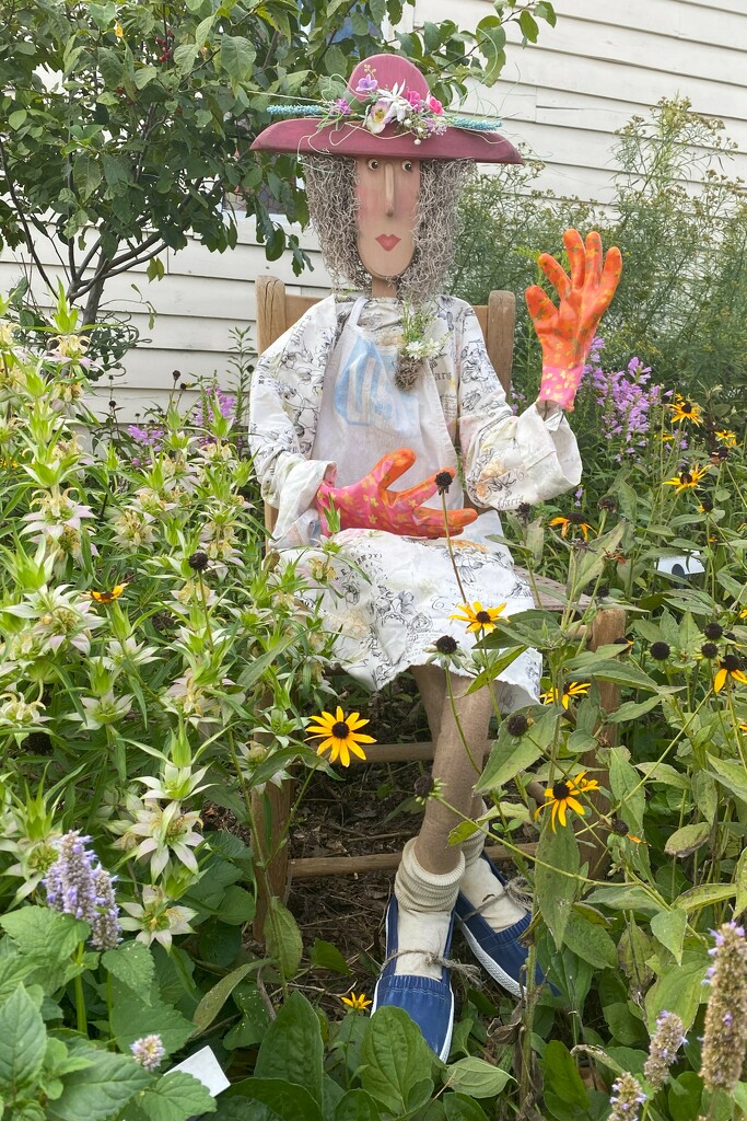 Gladys welcomes visitors to her garden by tunia