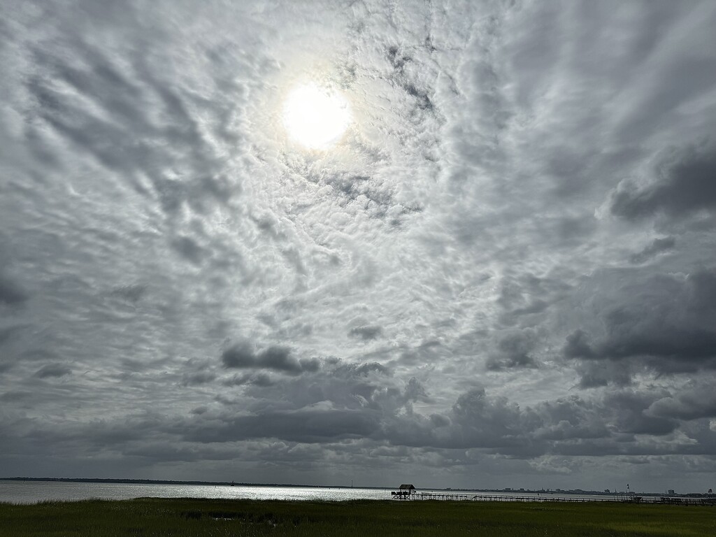 The vastness of clouds and sky over the harbor by congaree