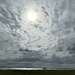 The vastness of clouds and sky over the harbor