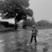 Lady walking her dog on a rainy morning