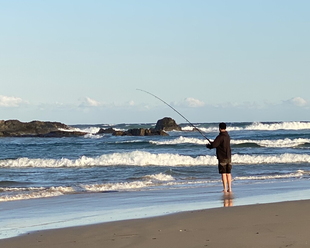 The lonely beach fisherman.  by johnfalconer