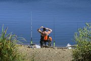 10th Sep 2024 - Fisherman takes a stretch on a slow day of fishing