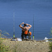 Fisherman takes a stretch on a slow day of fishing